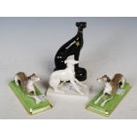 Pair of Halcyon Days ceramic greyhounds, together with a Nymphenburg white glazed porcelain figure