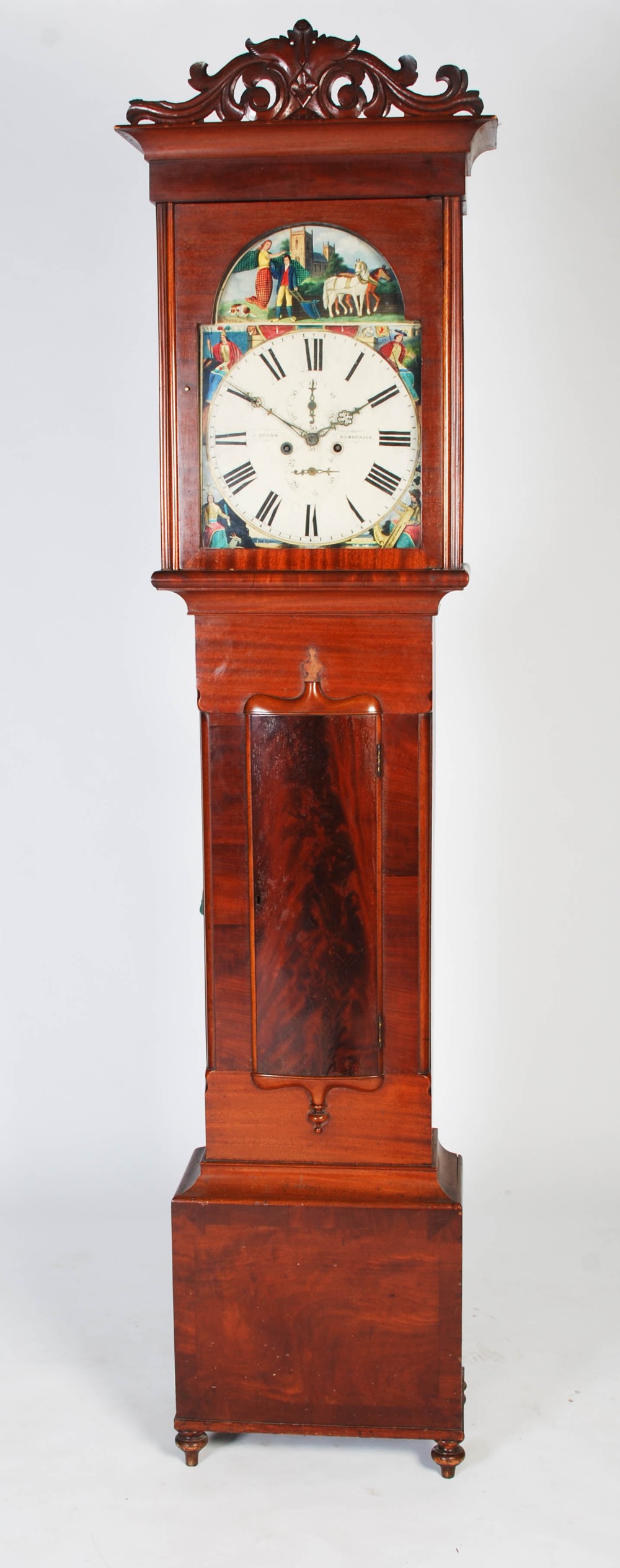 A 19th century Scottish mahogany longcase clock J. Brown, Kilmarnock, the caddy top hood with carved