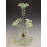 A Victorian vaseline glass epergne, centred with a tall flower tube and four smaller flower tubes on