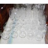 Large group of cut crystal drinking glasses, including a set of eight Edinburgh Crystal wine