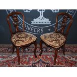 Two pairs of Victorian walnut balloon back chairs, one pair with oval upholstered backs and seats,