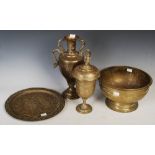 Four pieces of early 20th century Indian brass ware, including a baluster vase engraved with figures