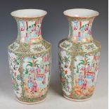 Pair of Chinese porcelain famille rose Canton vases, Qing Dynasty, decorated with panels of