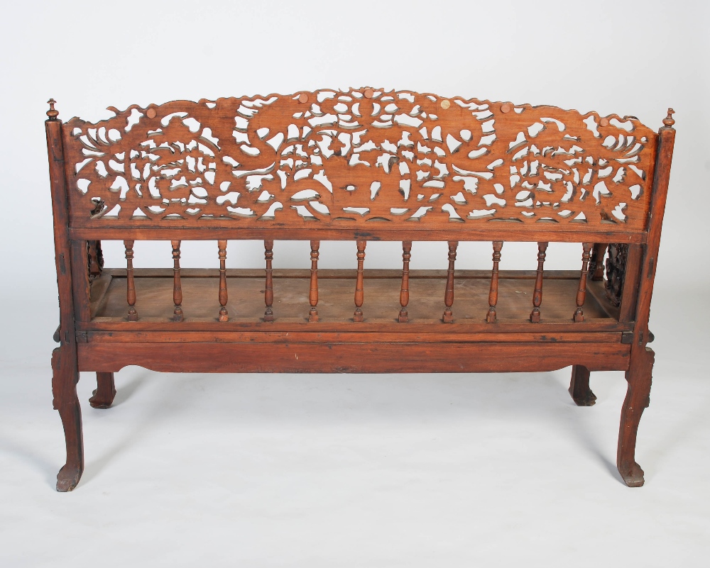 A Chinese carved darkwood bench, Qing Dynasty, the back richly carved in relief with two dragons - Image 8 of 8