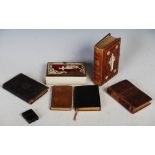 Group of miniature books, including Bibles, works of Shakespeare and scriptures, the largest 13cm