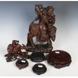 A Chinese dark wood carved figural group, the figure of an old man on top of an elephant together