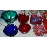 Group of six hand blown glass bowls, including two fluted pink examples, two red examples and a blue