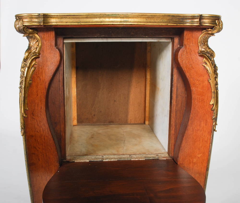 An early 20th century French oak and gilt bronze mounted marble topped bedside table in the manner - Image 7 of 8