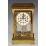 A late 19th century French gilt bronze four glass mantel clock, the case with fluted corners and