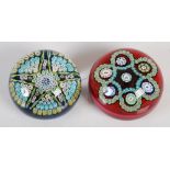 Two Perthshire Paperweights, comprising; a millefiori and latticino star weight on a blue ground,