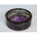 A Monart bottle stand/ straight sided bowl, shape ZK, mottled purple with decoration of typical