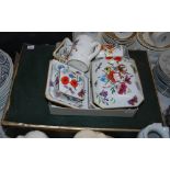Collection of Gucci ceramic home ware items, including floral ashtrays, floral trinket boxes, and