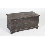 A late 19th / early 20th century carved dark stained pine coffer, the top and sides with a foliate