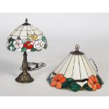 Modern Tiffany style lamp and shade, the shade with designs of roses and butterflies, the lamp