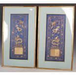 A pair of Chinese gold embroidered blue silk panels, 20th century, each depicting a phoenix, a