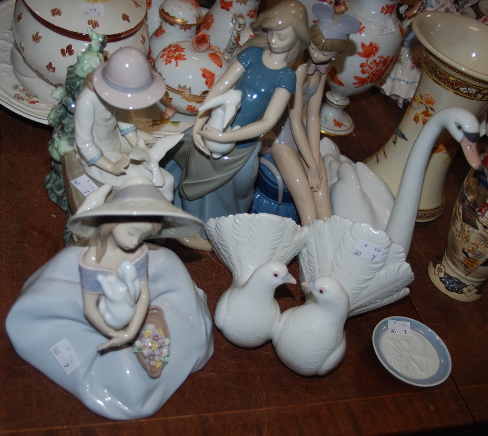 Group of six Lladro and Nao figures, including two Nao figures of girls playing with doves and bunny