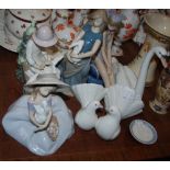 Group of six Lladro and Nao figures, including two Nao figures of girls playing with doves and bunny