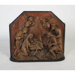A 19th century carved walnut relief of the Adoration of the Magi, probably Southern German,