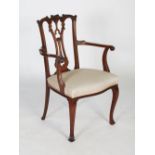 Edwardian finely carved mahogany carver dining chair, the serpentine back and pierced vase-shaped
