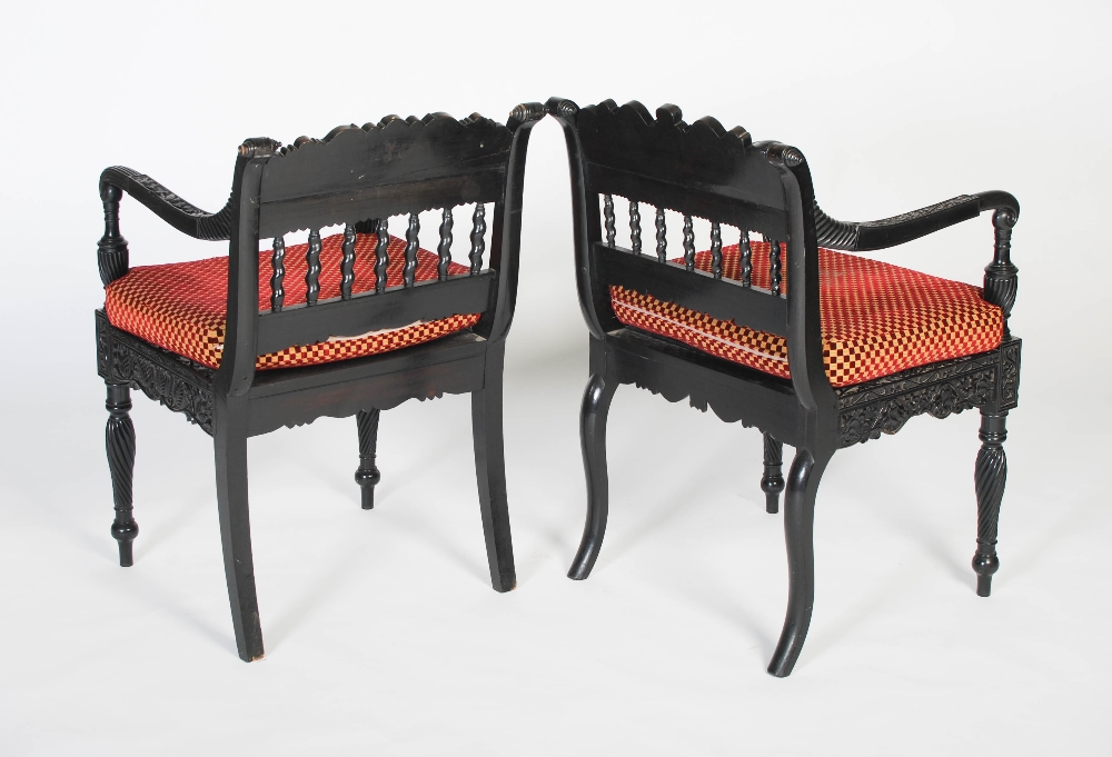 A pair of matched Anglo-Indian ebony armchairs, mid 19th century, possibly Ceylonese, the frames - Image 10 of 10