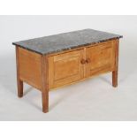A 20th century pine and grey marble bathroom stand/ pot cupboard, the single cupboard with two doors