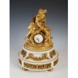 A late 19th century French gilt bronze and marble figural mantel clock, the figures of a young woman