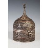 A late 19th / early 20th century Indian white metal spice box, of round form with domed lid with