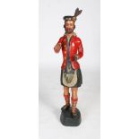 A rare 19th century carved and painted wood tobacco advertising figure in the form of a Highlander