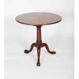 A 19th century mahogany tripod table, the round top supported by a single column with three sweeping
