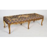 A French Regence style tapestry upholstered giltwood window seat, early 20th century, with a