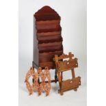 Modern mahogany magazine rack, with four tiers together with a South Asian carved teak collapsible