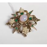 Costume jewellery brooch centred with oval cabochon opal.