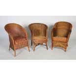 Three wicker Lloyd Loom style tub armchairs, two with padded seats, the largest 80cm high.