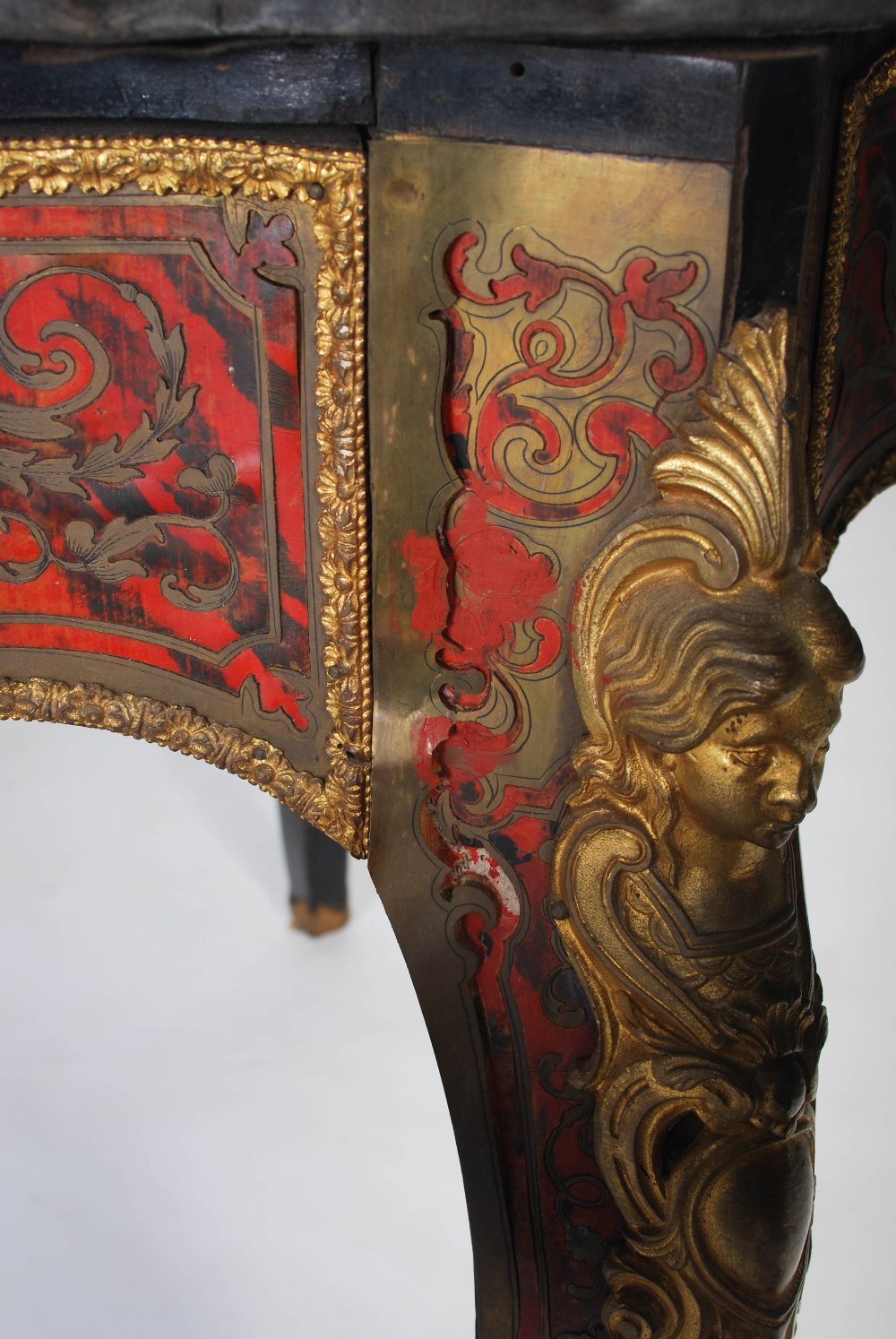 A 19th century ebonised and gilt metal mounted boulle centre table. The shaped oval top with gilt - Image 7 of 9