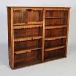 Oak and stained pine two-section bookcase, with rows of graduated adjustable shelves, many shelves