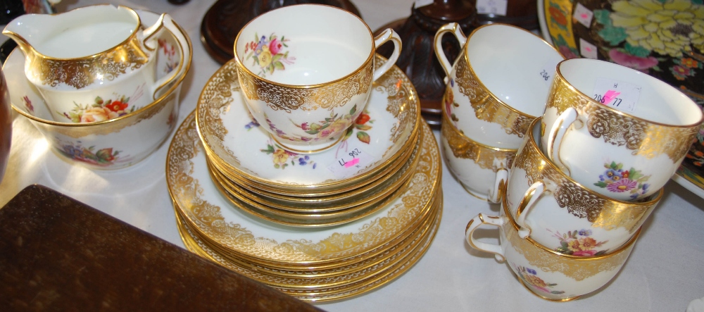 Early 20th century Hammersley & Co. gilt floral tea service, including six cups, saucers, side