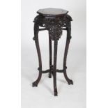 A Chinese carved darkwood jardiniere stand, Qing Dynasty, the octagonal top inset with marble,