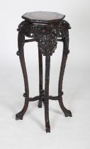 A Chinese carved darkwood jardiniere stand, Qing Dynasty, the octagonal top inset with marble,