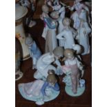 Group of nine Lladro figures of children, including several modelled as children in their night