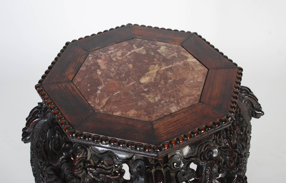 A Chinese carved darkwood jardiniere stand, Qing Dynasty, the octagonal top inset with marble, - Image 2 of 6