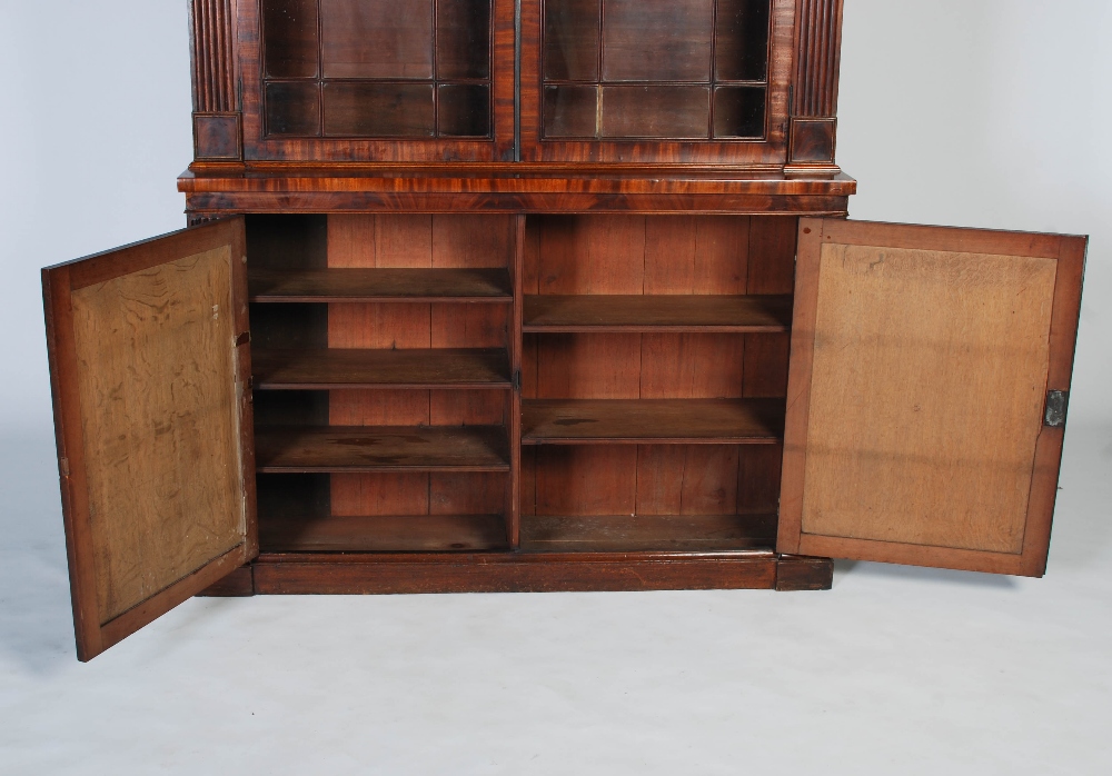 A 19th century mahogany bookcase of slender proportion, the large glazed doors flanked by two reeded - Image 3 of 4