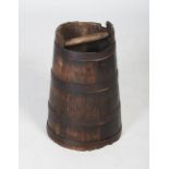 An oak pail/ bucket, of oak staves bound by four iron bands with a single oak handle to the top,