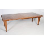 Large early 20th century oak extending dining table, the rectangular top with chamfered corners, and