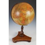 An early 20th century Geographia 12 inch Terrestrial Globe, 55 Fleet Street, London, on turned