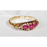An 18ct gold synthetic ruby and diamond chip ring.