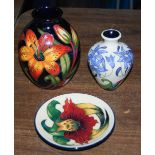Three pieces of modern Moorcroft Pottery, to include blue ground vase decorated with flowers and