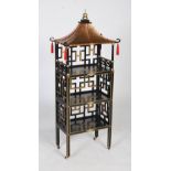 A Chinoiserie style whatnot, with a copper plated pagoda roof and three tiers with geometric pierced