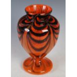 A rare Monart vase, probably shape U, mottled orange with horizontal black bands and four pulled