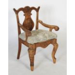 Late 19th/ early 20th century Anglo-Indian carved teak armchair, the back, arms and body carved in