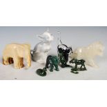 Group of animal figures, to include several carved hardwood figures of an elephant, a lion, and